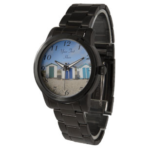 english seaside blue skies and beach huts watch