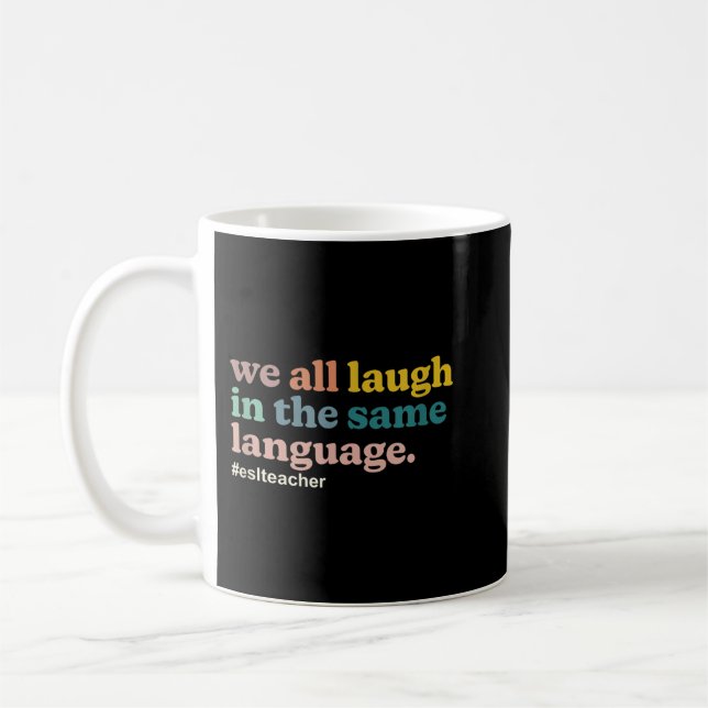 ESL Teacher We All Laugh in the Same Language. Col Coffee Mug (Left)
