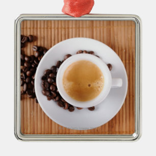 Espresso cup on a mat metal tree decoration