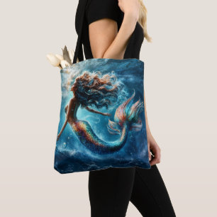 Ethereal aquatic mermaid beauty in deep blue tote bag