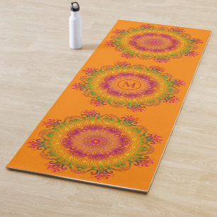 Ethnic floral mandala on orange background. yoga m mat