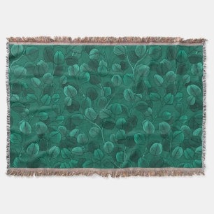 Eucalyptus on green throw blanket