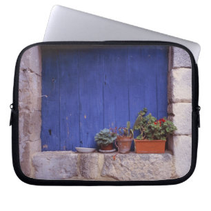 Europe, France, Cereste. A blue door adds colour Laptop Sleeve