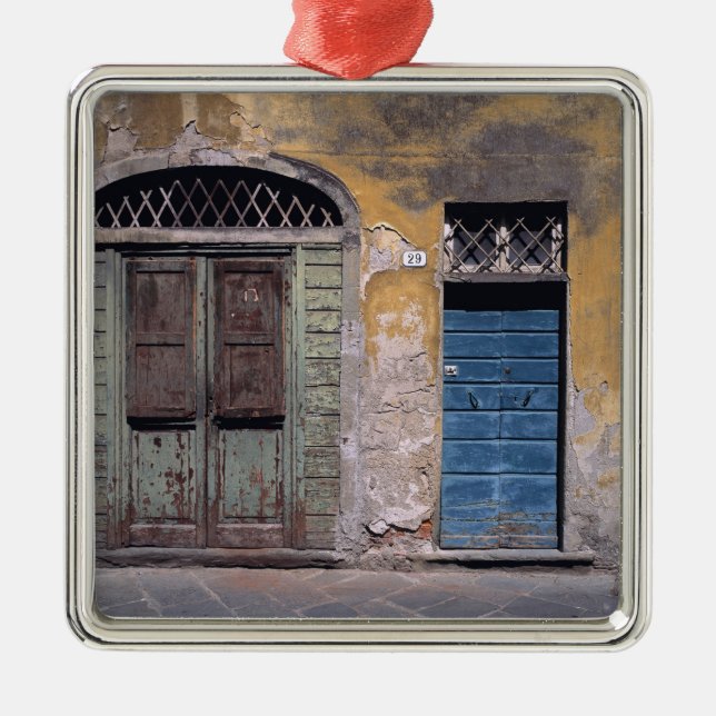 Europe, Italy, Lucca. These old doors add Metal Tree Decoration (Front)