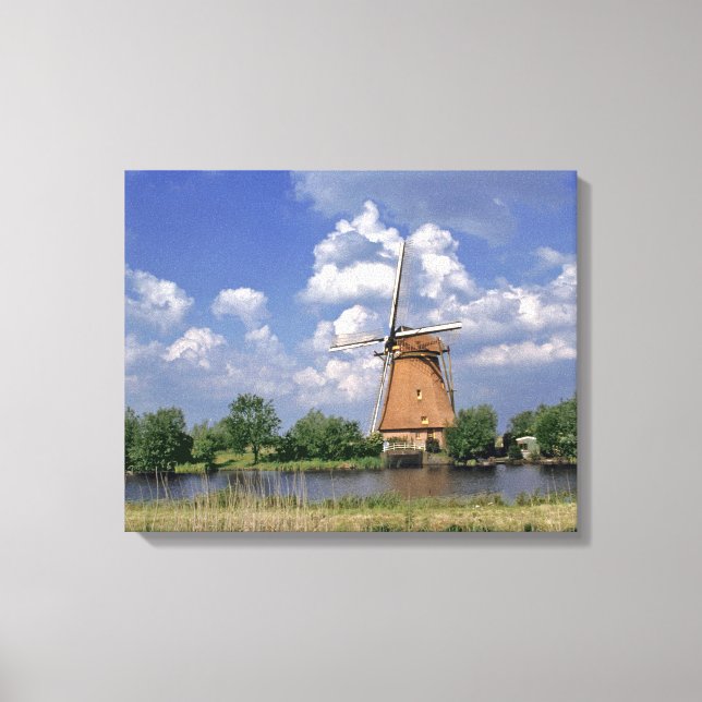 Europe, Netherlands, Kinerdijk. A windmill sits Canvas Print (Front)