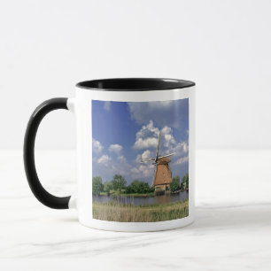 Europe, Netherlands, Kinerdijk. A windmill sits Mug