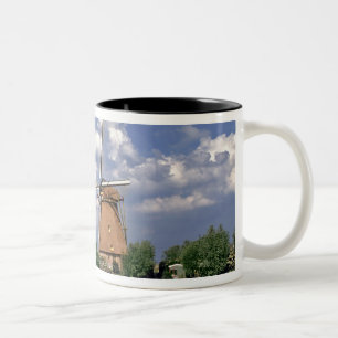 Europe, Netherlands, Kinerdijk. A windmill sits Two-Tone Coffee Mug