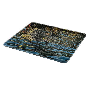 Evening lights on the sea cutting board