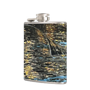 Evening lights on the sea hip flask