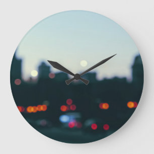 Evening Warsaw: Blurry Cityscape Silhouette. Large Clock