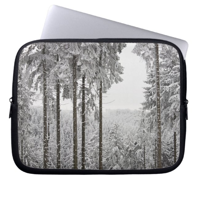 Evergreen forest in winter laptop sleeve (Front)