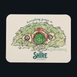 Everything Grows in THE SHIRE™ Magnet<br><div class="desc">Bring a little piece of Middle-Earth™ to your everyday with this charming Lord of the Rings™ design inspired by the cozy hills of Hobbiton. Featuring a storybook-style hobbit hole with its iconic round green door tucked into a lush hillside, the artwork is paired with the beloved phrase, “Everything grows in...</div>