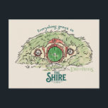 Everything Grows in THE SHIRE™ Postcard<br><div class="desc">Bring a little piece of Middle-Earth™ to your everyday with this charming Lord of the Rings™ design inspired by the cozy hills of Hobbiton. Featuring a storybook-style hobbit hole with its iconic round green door tucked into a lush hillside, the artwork is paired with the beloved phrase, “Everything grows in...</div>