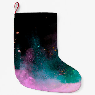 Explosion of colored powder isolated on black back small christmas stocking