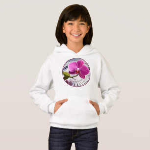 Exquisite Pink Orchid Rests on Silver Plate
