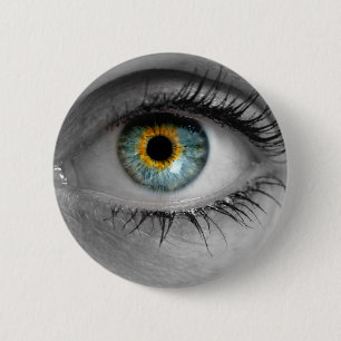 Eye looks to viewer concept macro 6 cm round badge