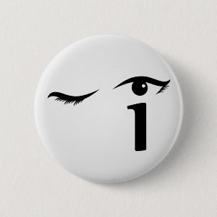Eye winking with letter i forming the eyeball 6 cm round badge