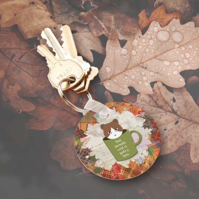 Fall Break Cat Key Ring (A Fall Break Cat Keychain is on the ground.)