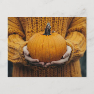fall greeting card with woman holding a pumpkin
