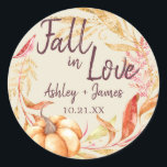 Fall in Love Antique White Wedding Monogram Classi Classic Round Sticker<br><div class="desc">"Fall in Love" rustic themed wedding favour stickers feature orange and golden autumn foliage, a fall watercolor pumpkin and customisable monogram of the bride and groom's names and wedding date on an antique white background. Exclusively designed for you by Happy Dolphin Studio. If you need any help or matching products,...</div>