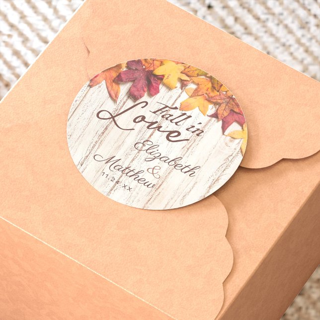 Fall in Love Autumn Leaves Rustic Wood Wedding Classic Round Sticker (Fall in Love Wedding sticker is perfect for an autumn wedding with the changing of the leaves.)