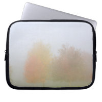 Fall trees shrouded in mist