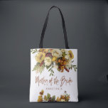 Fall wedding floral modern mother of the bride tote bag<br><div class="desc">Modern rustic mother of the bride typography tote bag featuring autumn fall rusty orange gold and ivory cream flowers with dried leaves and foliage and a whimsical chic script.             Personalise it with mother's name on the front side and with the wedding couple names and date on the reverse.</div>