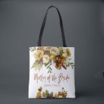 Fall wedding floral modern mother of the bride tote bag<br><div class="desc">Modern rustic mother of the bride typography tote bag featuring autumn fall rusty orange gold and ivory cream flowers with dried leaves and foliage and a whimsical chic script.             Personalise it with mother's name on the front side and with the wedding couple names and date on the reverse.</div>