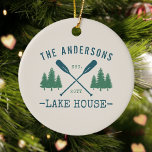 Family Name Lake House Rustic Oars Pine Trees Ceramic Tree Decoration<br><div class="desc">A beautiful, rustic themed ceramic ornament, featuring your family name and lake house, cabin, cottage or other desired text and its established date, all in rustic style typography. This unique, custom design features teal blue boat oars, paddles and pine trees in soft green. The designs cream base colour is easily...</div>