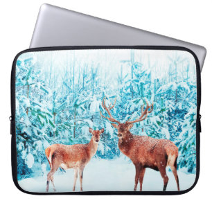 Family of noble deer in a snowy winter. Christmas Laptop Sleeve