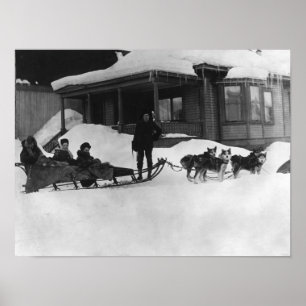 Family travelling by Dog Sled in Alaska Poster