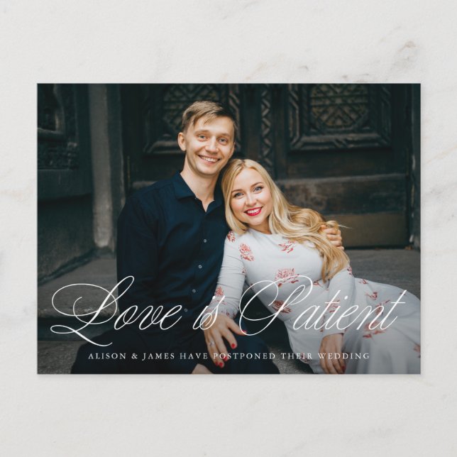 Fancy Script Love is Patient Wedding Postponement Announcement Postcard (Front)