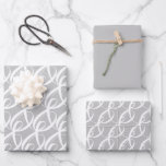 Fancy White Togetherness Symbol on Silver Wedding Wrapping Paper Sheet<br><div class="desc">The design features a white togetherness script in an elegant and unique pattern on silver background, to celebrate the bride's and groom's special day. The wrapping paper is also suitable for engagements, wedding anniversaries, Valentine's Day, Sweetest Day, or any other occasion to celebrate togetherness and unity! Design related items available...</div>