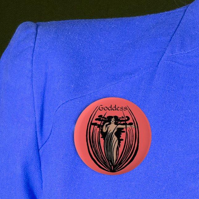 Fantasy Goddess Button (Goddess woman long black hair in abstract black flower pod on round salmon coloured pin back button.)