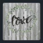 Farmhouse Inspiration - Love Square Wall Clock<br><div class="desc">Farmhouse Inspiration I by Jennifer Paxton Parker. Features "Love" in script with a beautiful green wreath and distressed wood panels.</div>