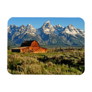 Farms Barn Shadowed by Snow Capped Mountains Magnet