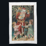 Father Christmas with Dancing Children & Mistletoe Tea Towel<br><div class="desc">Jolly red-robed vintage Santa holding his sack of presents and holly with three happy children dancing around him with mistletoe overhead and gold highlights. Background colour is customisable.</div>