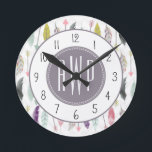 Feathers and Arrows Monogram Round Clock<br><div class="desc">A gift featuring a pattern of feathers and arrows.  Personalise with your monogram.</div>