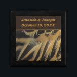 Feathers Layered Brown Gold Wedding Keepsake Gift Box<br><div class="desc">This beautiful wedding keepsake gift box features a photo of elegant duck feathers.  The beautiful brown and gold feathers form long ovals that overlap revealing wispy feathering.  Quickly and easily personalise the bride and groom's names and wedding date which appears against a solid dark brown banner.</div>
