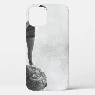 Female swimmer on rock above crashing surfvintage, iPhone 12 case