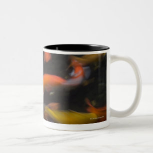 Feng Shui believe koi fish bring good luck. Two-Tone Coffee Mug