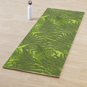 Fern in green yoga mat
