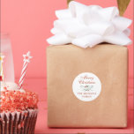 Festive Blue Ribbon and Poinsettia Christmas Classic Round Sticker<br><div class="desc">Send your family and friends holiday cheer by wrapping your Christmas card in this personalised holiday envelope. The front of this white envelope features elegant text along a garland of hand-drawn blue ribbon and red poinsettias while the inside features a blue ribbon pattern printed inside. Traditional fonts keep the design...</div>