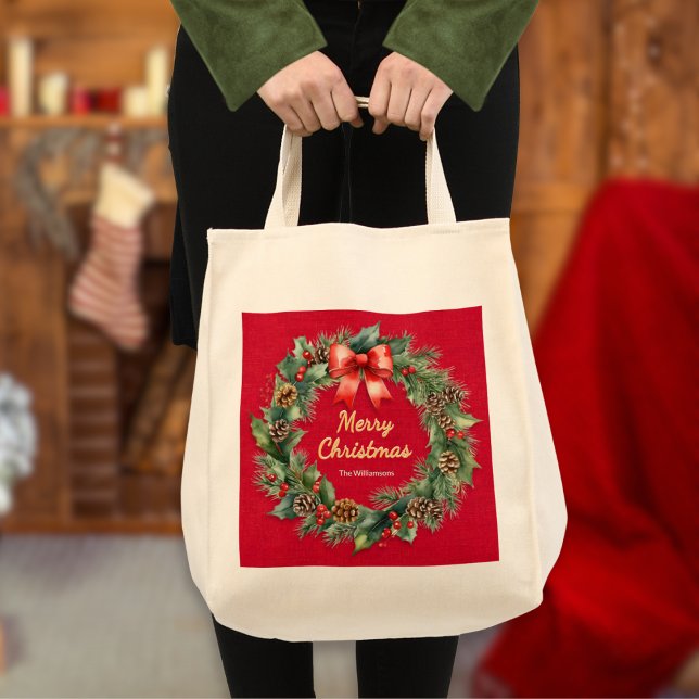 Festive Christmas Wreath Elegant Red Personalised Tote Bag (An elegant tote bag with festive wreath on a red background, Merry Christmas greeting and custom nam)