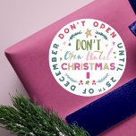 Festive, Fun & Colourful Do Not Open Til Christmas Classic Round Sticker<br><div class="desc">No peeking! safeguard your Christmas presents from your sneaky peekers with our fun, whimsical and colourful "Don't Open until Christmas" stickers. The Design features different fun and bold typographic typography to create a fun design. Bright colours of reds, pinks, greens, blues and faux gold accents creates an eye catching design....</div>