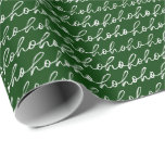 Festive Ho Ho Ho Christmas Wrapping Paper<br><div class="desc">Get into the holiday spirit with this fun and festive ho ho ho wrapping paper. The design features a bold, classic forest green background with a cheerful "ho ho ho" pattern in a delightful white script. The playful, handwritten style of the text brings a sense of joyful movement and personal...</div>