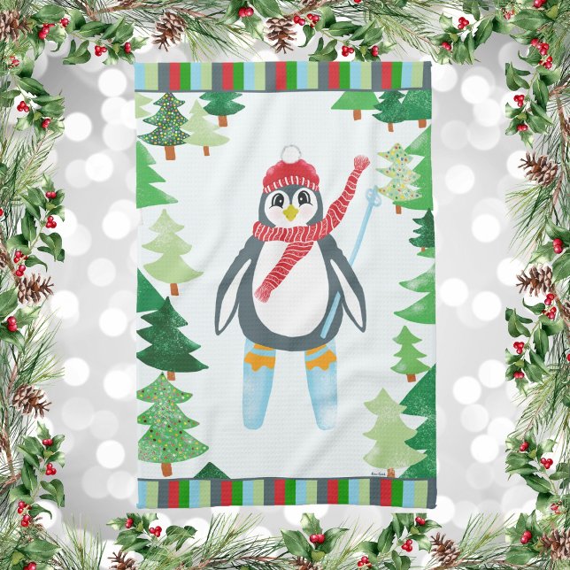 Festive Penguin Skiing Christmas Design Tea Towel (Winter Holiday Penguin Skiing on a Mountain Of Christmas Trees Kitchen Towel)