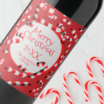 Festive Red and White Candy Canes Christmas Wine Label<br><div class="desc">Add a personal touch to your holiday celebrations with our customisable Christmas wine label. This festive label is adorned with a cheerful red background, sprinkled with whimsical white and red candy canes. At the heart of the design, a white circle proudly proclaims 'Merry Christmas' in a vibrant red font. What...</div>
