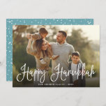 Festive Script Overlay Hanukkah Photo Holiday Card<br><div class="desc">Simple and chic Hanukkah photo card features your favourite family photo overlaid with "Happy Hanukkah" in white modern script lettering. Personalise with your family name and the year along the bottom. Cards reverse to a snow and stars pattern in festive teal and white.</div>