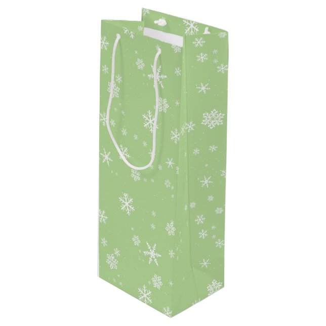 Festive Snowflakes on Green Christmas Holiday Wine Gift Bag (Front Angled)